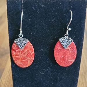 Red oval earrings with sterling silver design